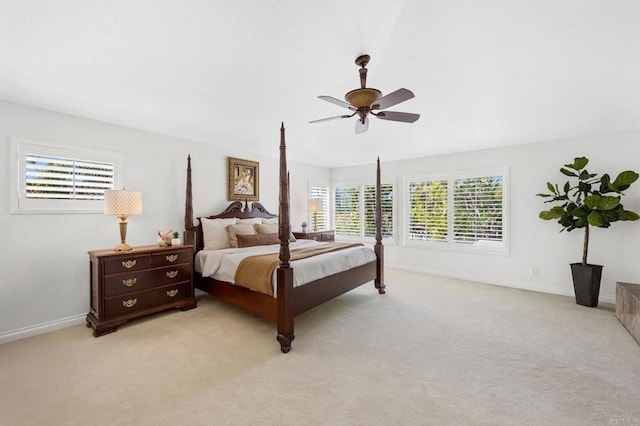 bedroom with light colored carpet and ceiling fan