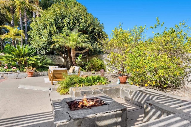 view of patio / terrace featuring a fire pit