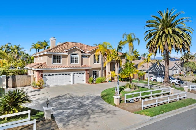 mediterranean / spanish house featuring a garage