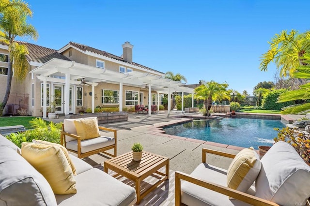 view of pool with a pergola, outdoor lounge area, a patio, and french doors