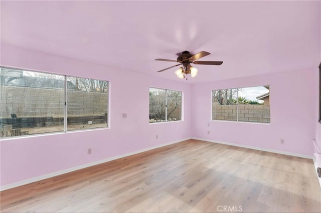 unfurnished room featuring ceiling fan and light hardwood / wood-style floors