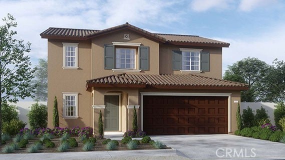 mediterranean / spanish-style home featuring a garage