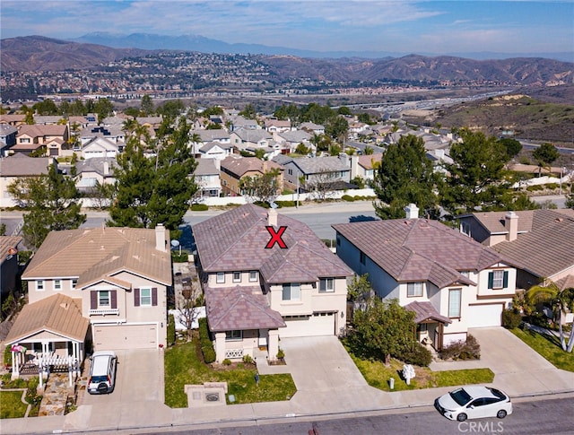 bird's eye view featuring a residential view and a mountain view