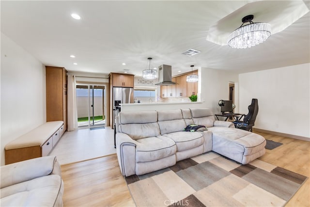 5058 Rose Ave, Riverside, CA 92505 - living area featuring a notable chandelier, visible vents, light wood-style flooring, and recessed lighting