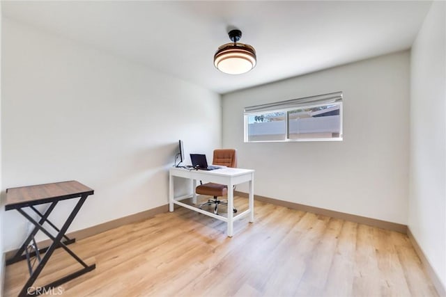 5058 Rose Ave, Riverside, CA 92505 - office area featuring baseboards and wood finished floors