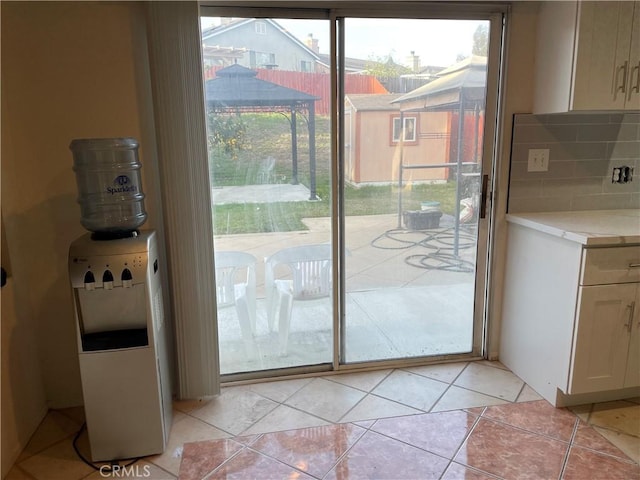 entryway featuring light tile patterned floors