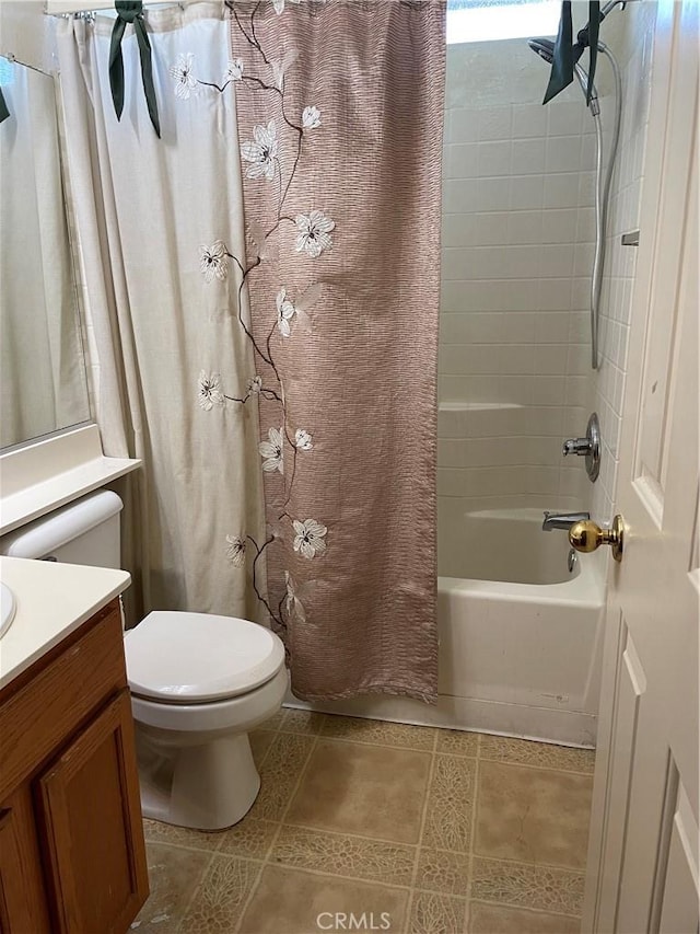 full bathroom featuring shower / bathtub combination with curtain, vanity, tile patterned floors, and toilet