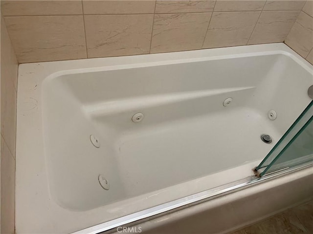 bathroom featuring a tub to relax in