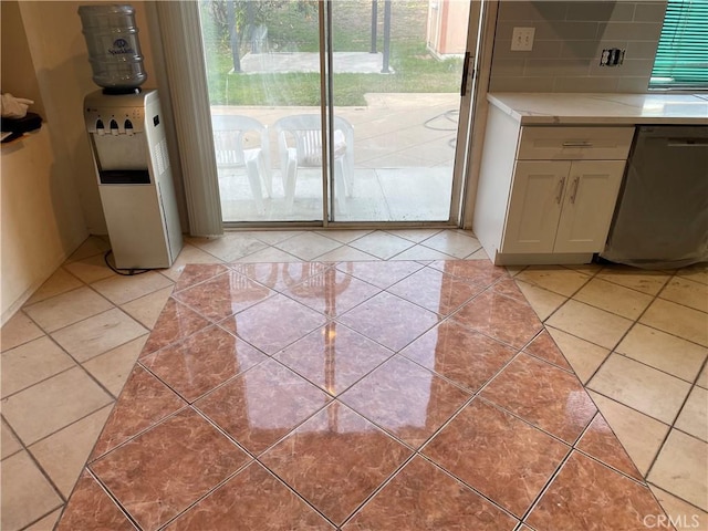 doorway featuring light tile patterned flooring