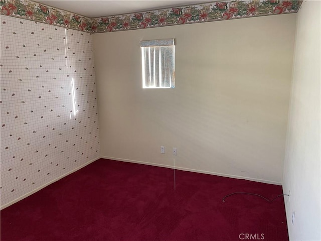 unfurnished room with carpet flooring