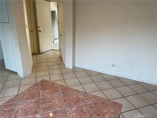 spare room with light tile patterned floors