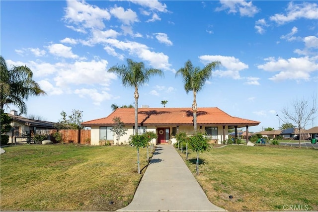 single story home featuring a front lawn