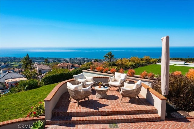 view of patio with a water view