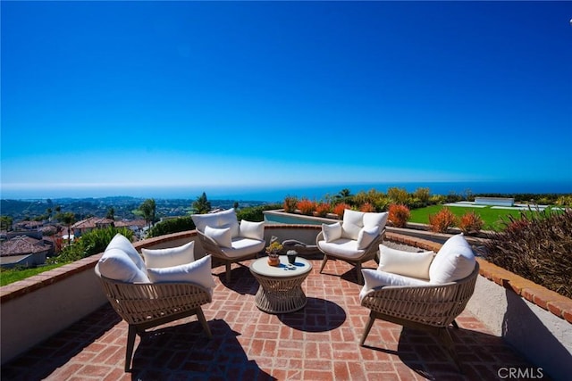 view of patio with an outdoor hangout area and a water view