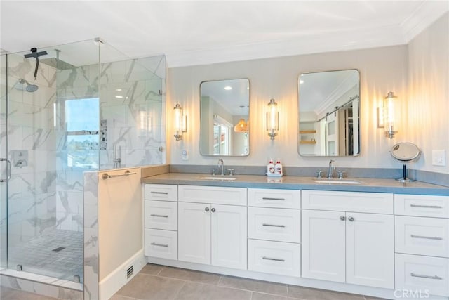 full bath with ornamental molding, a sink, a marble finish shower, and double vanity