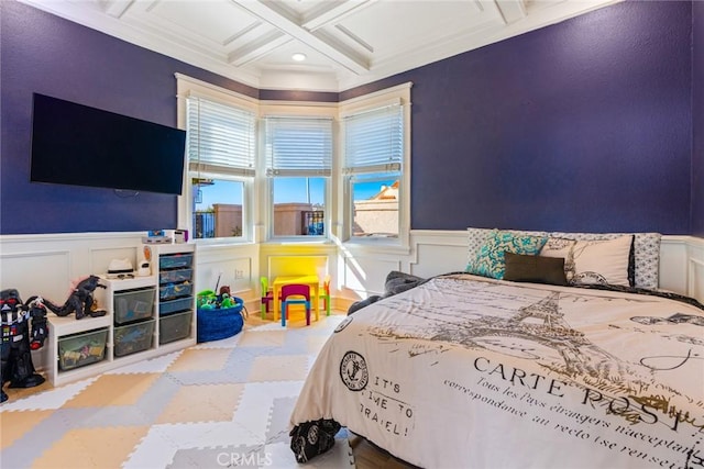 bedroom with wainscoting, coffered ceiling, and beam ceiling