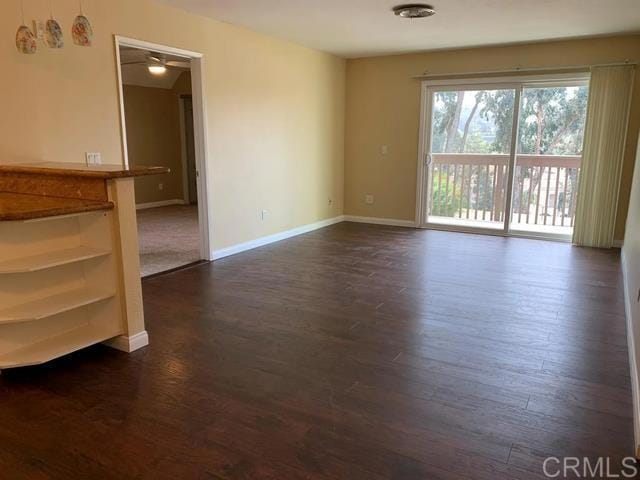 empty room featuring dark hardwood / wood-style floors