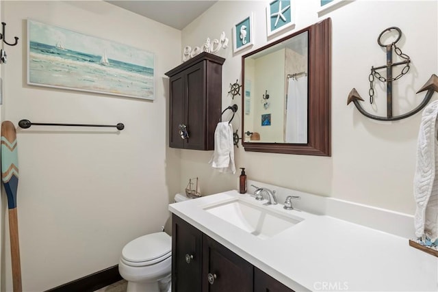 full bath with toilet and vanity