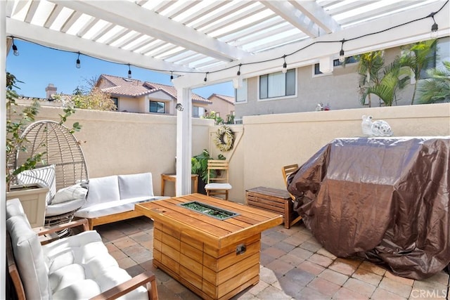 view of patio / terrace with fence, an outdoor living space, and a pergola