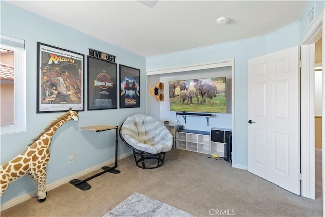 living area with carpet floors, visible vents, and baseboards