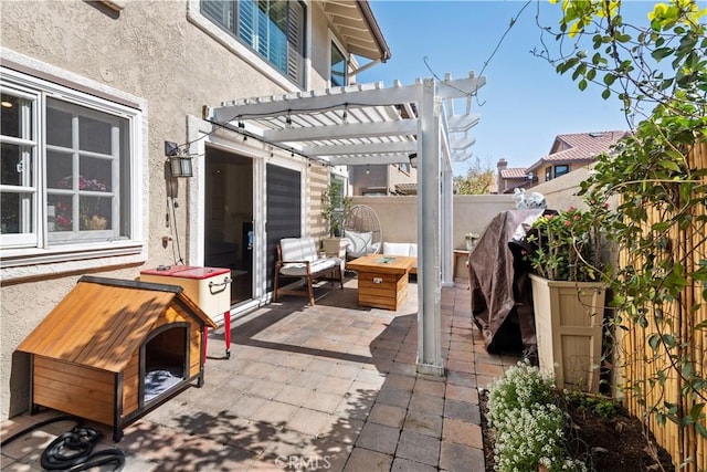 view of patio with fence and a pergola