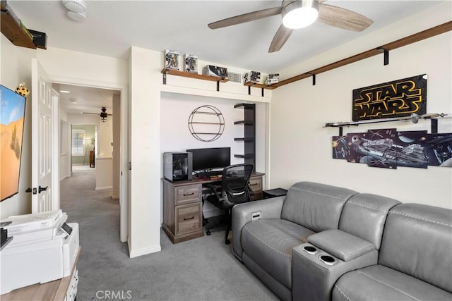 home office featuring carpet floors and a ceiling fan