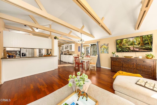 living room with lofted ceiling with beams, a notable chandelier, wood finished floors, and baseboards