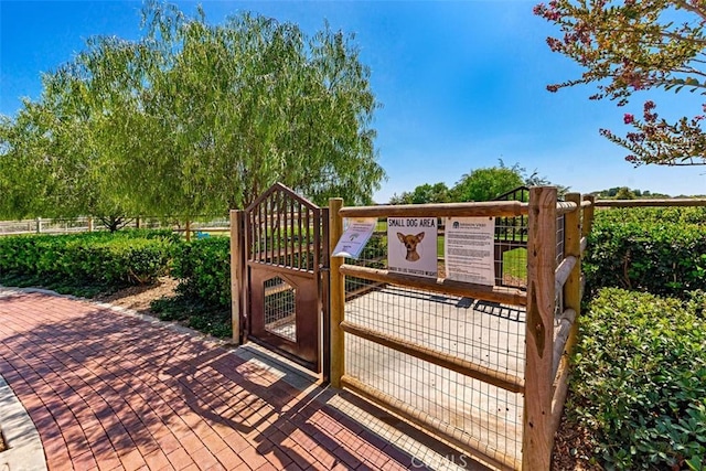 wooden terrace with fence and a gate