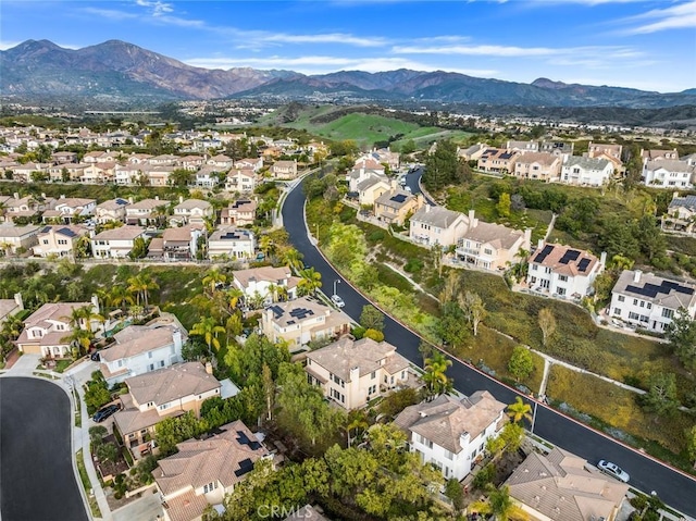 birds eye view of property with a mountain view and a residential view