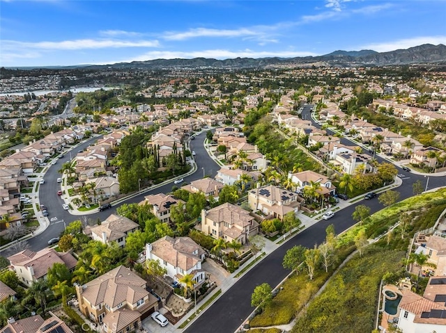 birds eye view of property with a mountain view and a residential view