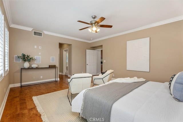 bedroom with visible vents, crown molding, baseboards, wood finished floors, and a ceiling fan