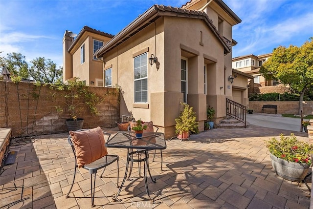 view of patio / terrace featuring fence