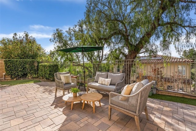 view of patio / terrace with outdoor lounge area and fence