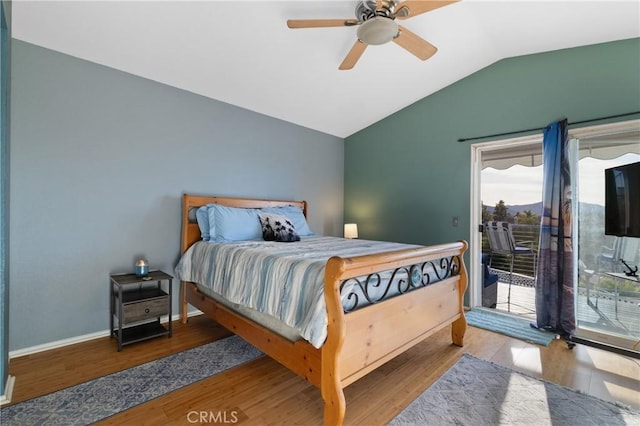 bedroom featuring lofted ceiling, access to outside, baseboards, and light wood-style flooring