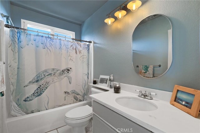 bathroom featuring toilet, a textured wall, shower / bath combination with curtain, and vanity