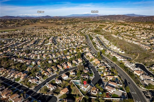 birds eye view of property with a residential view and a mountain view