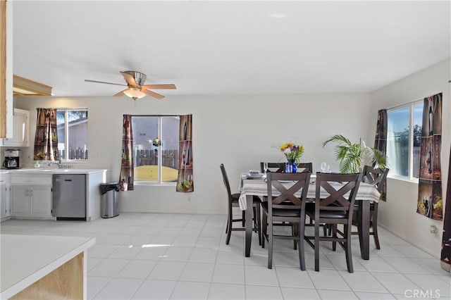 dining room with light tile patterned floors, ceiling fan, and baseboards