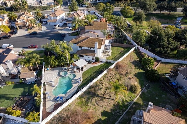 birds eye view of property with a residential view