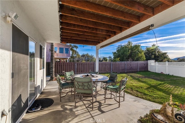 view of patio / terrace with outdoor dining space and a fenced backyard