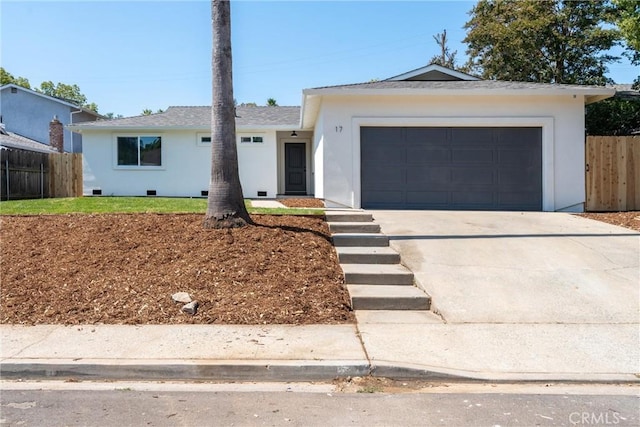 ranch-style house featuring a garage