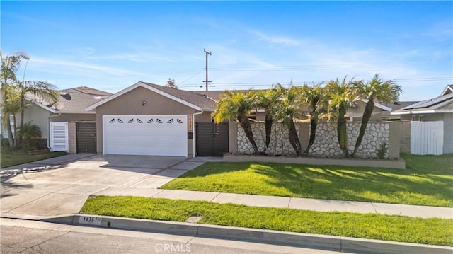 view of front of house with a front yard and a garage