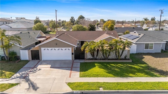 view of front of house featuring a front lawn and a garage