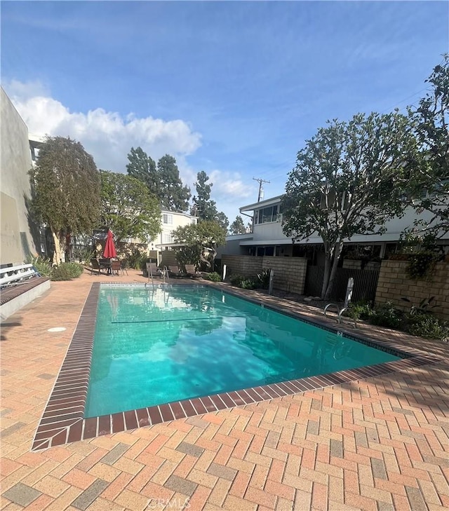 view of swimming pool with a patio