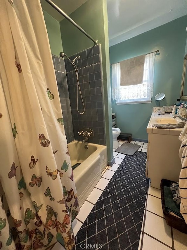 full bathroom with vanity, shower / bathtub combination with curtain, tile patterned floors, and toilet