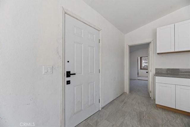 hall with lofted ceiling