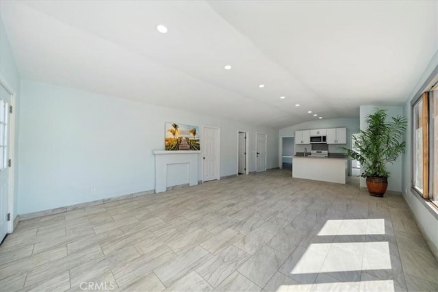 69719 Palm Springs Ave, Mountain Center, CA 92561 - unfurnished living room with a wealth of natural light, vaulted ceiling, and recessed lighting