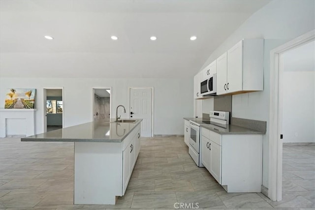 69719 Palm Springs Ave, Mountain Center, CA 92561 - kitchen featuring an island with sink, vaulted ceiling, a sink, white appliances, and white cabinetry
