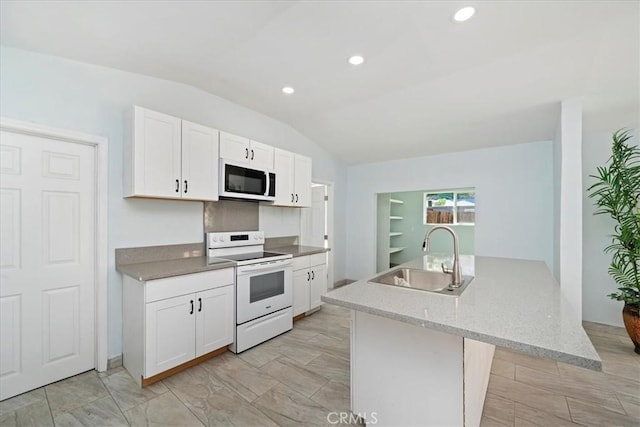 69719 Palm Springs Ave, Mountain Center, CA 92561 - kitchen with a sink, white appliances, lofted ceiling, white cabinetry, and recessed lighting