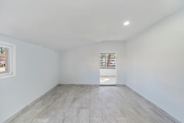 69719 Palm Springs Ave, Mountain Center, CA 92561 - spare room with baseboards, vaulted ceiling, wood tiled floor, and recessed lighting