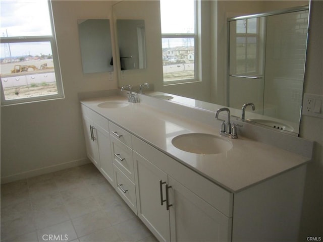 3620 S Allston Paseo Unit 7, Ontario, CA 91761 - bathroom featuring double vanity, baseboards, and a sink